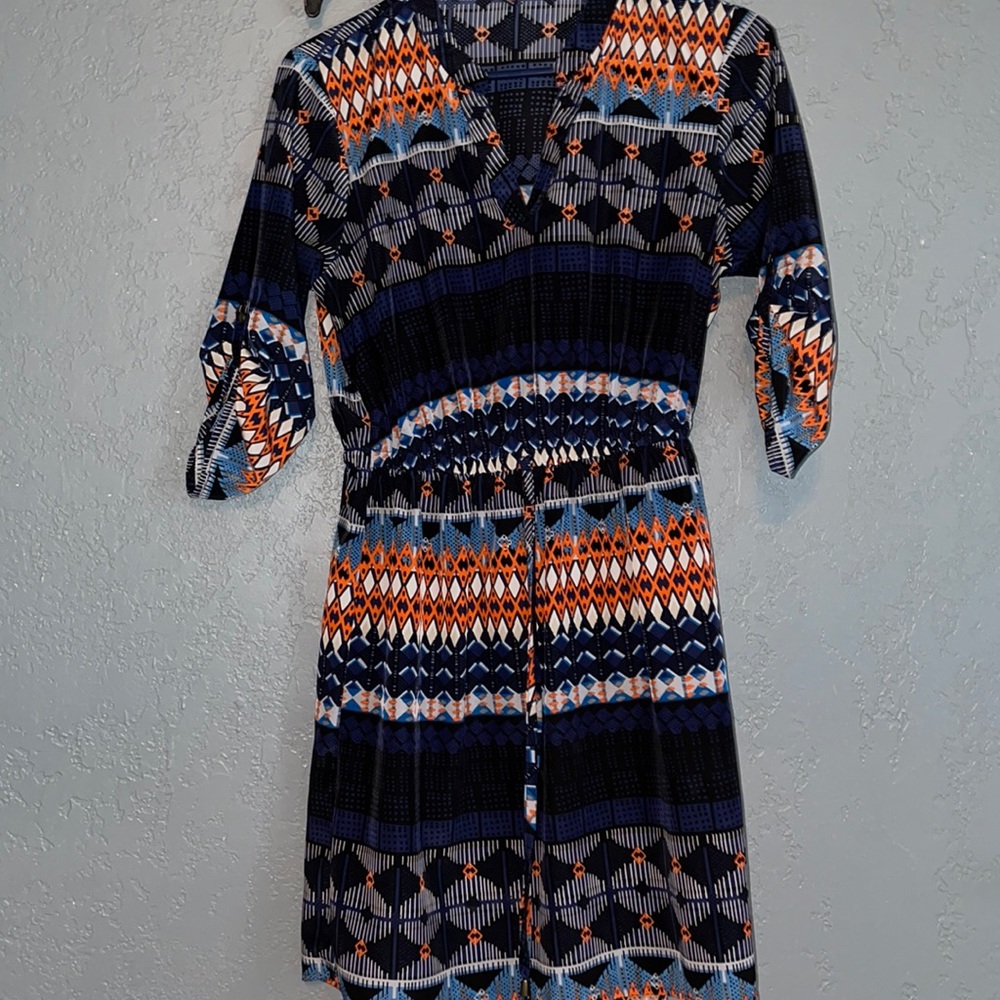 Women’s midi dress. 3/4 sleeve with button accent.